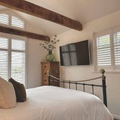 Shutters on french door and gable in bedroom